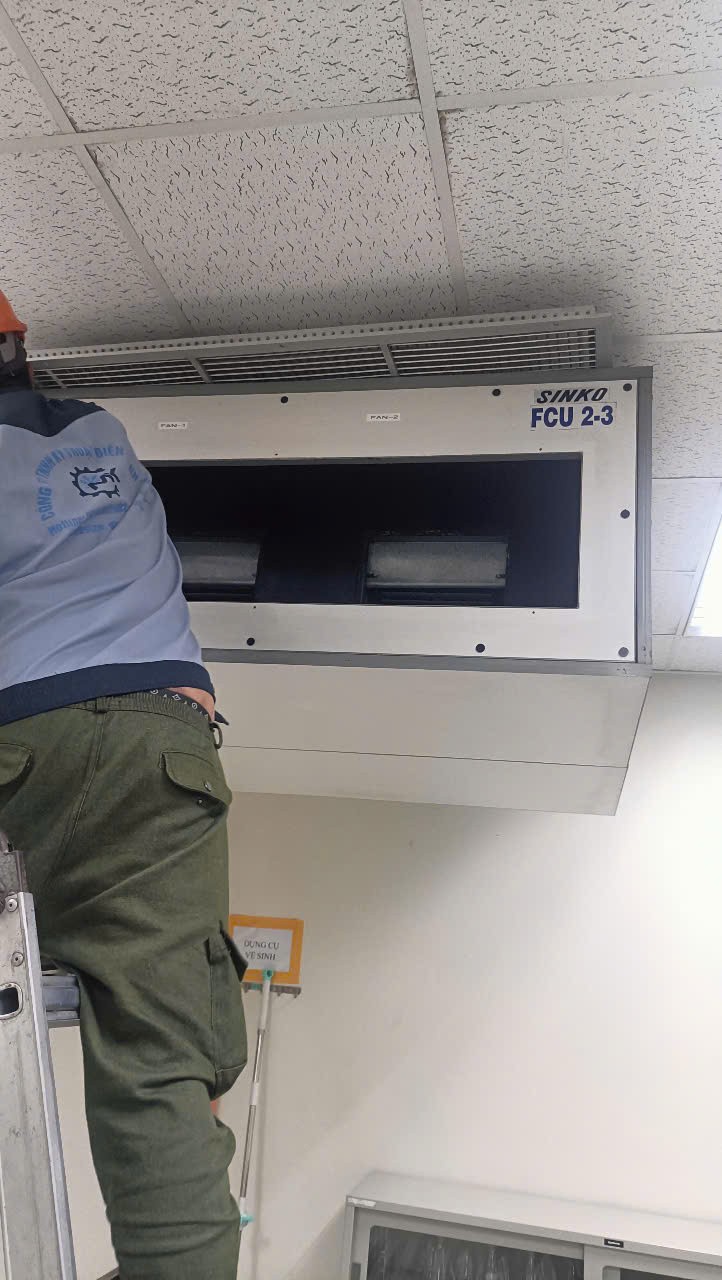 Technician repairing a cooling system