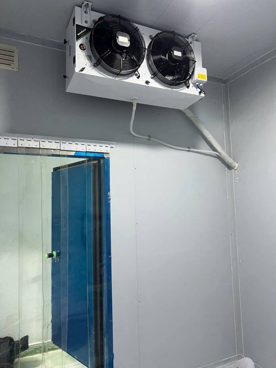 refrigeration technician checking cooling system