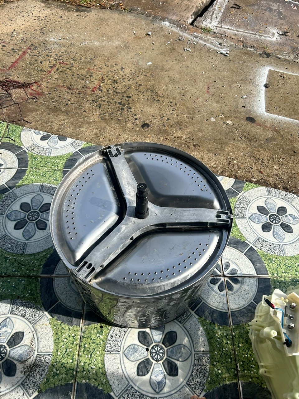 image of a happy customer with a repaired washing machine
