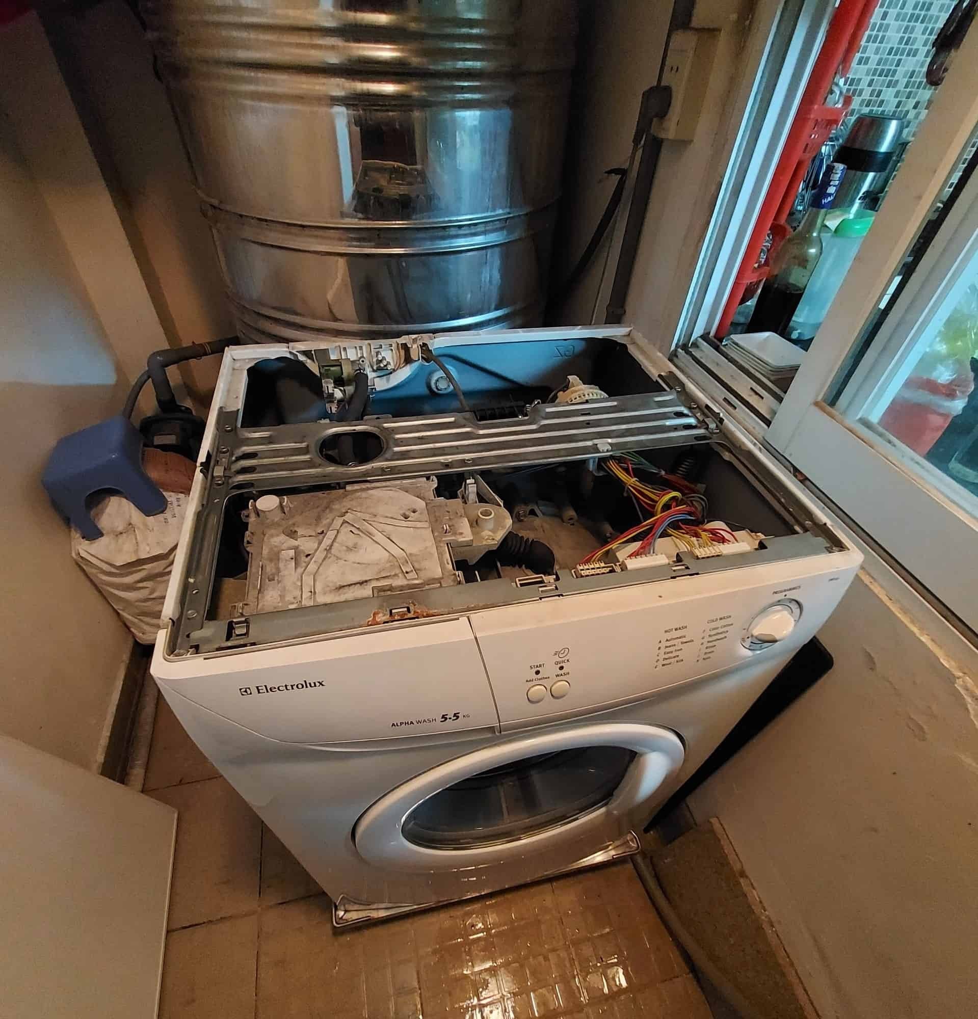 washing machine repair technician working