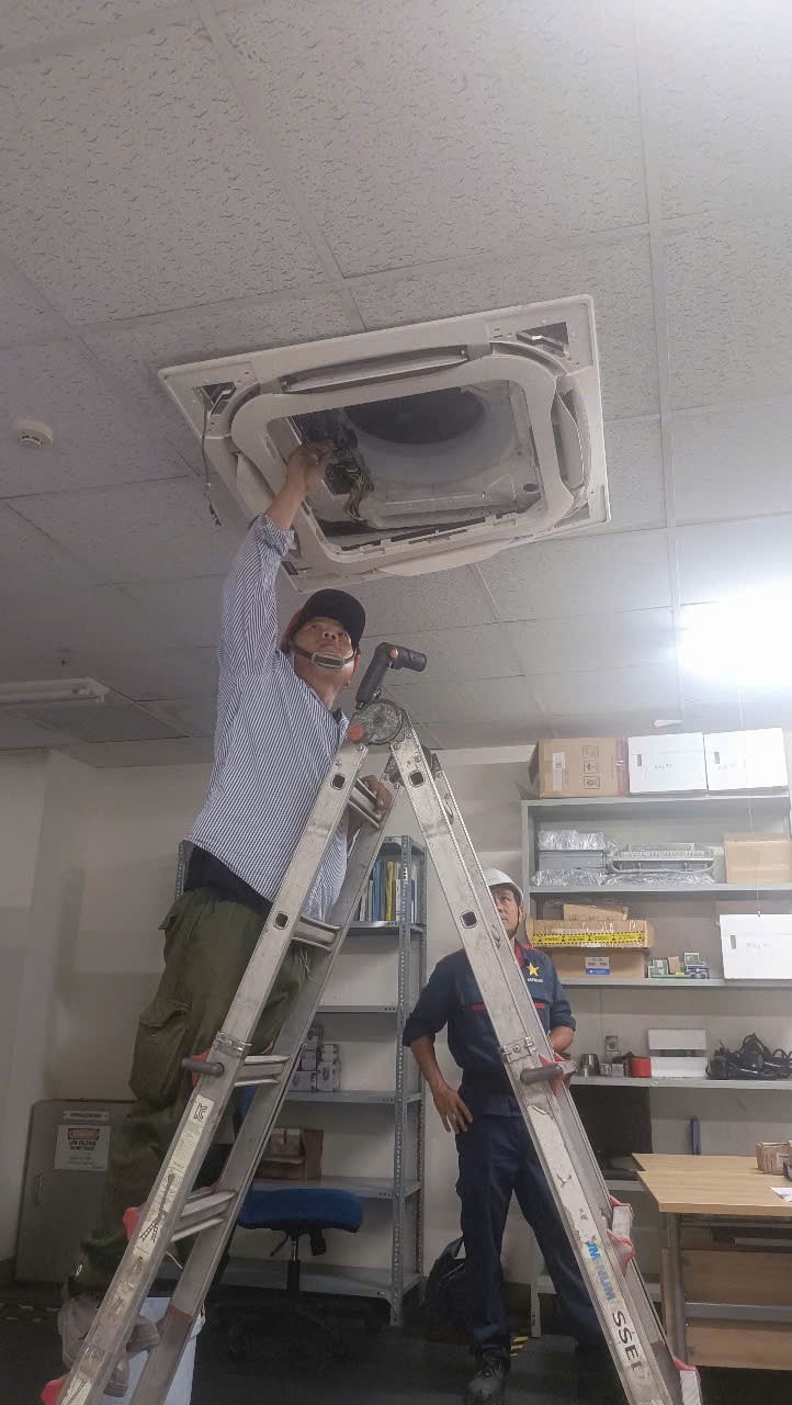 woman cleaning air conditioner filter