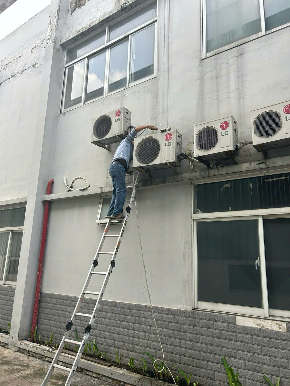 man checking air conditioner