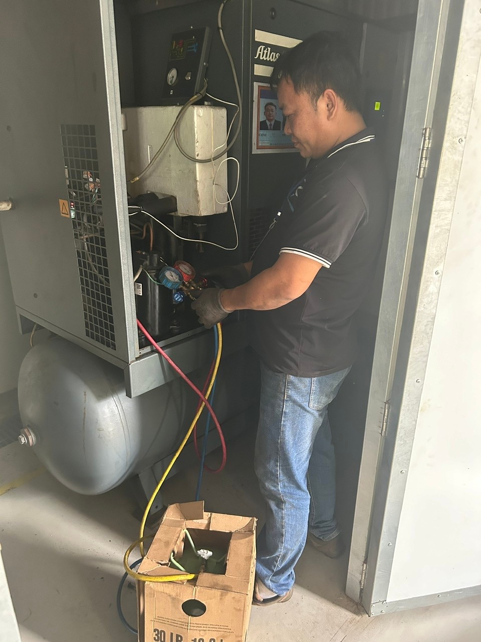 technician repairing air dryer