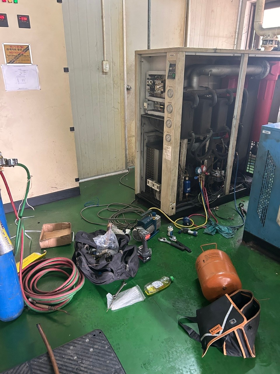 technician repairing air dryer
