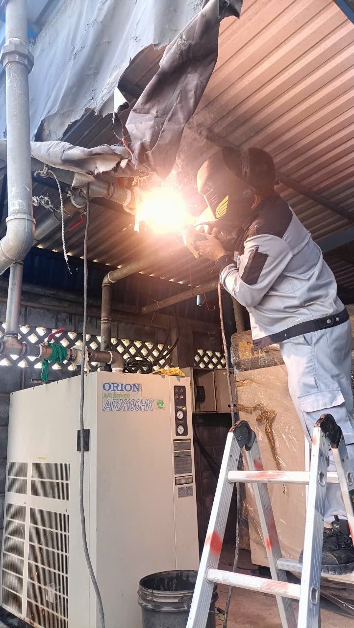 image of a technician using diagnostic tools on an air dryer
