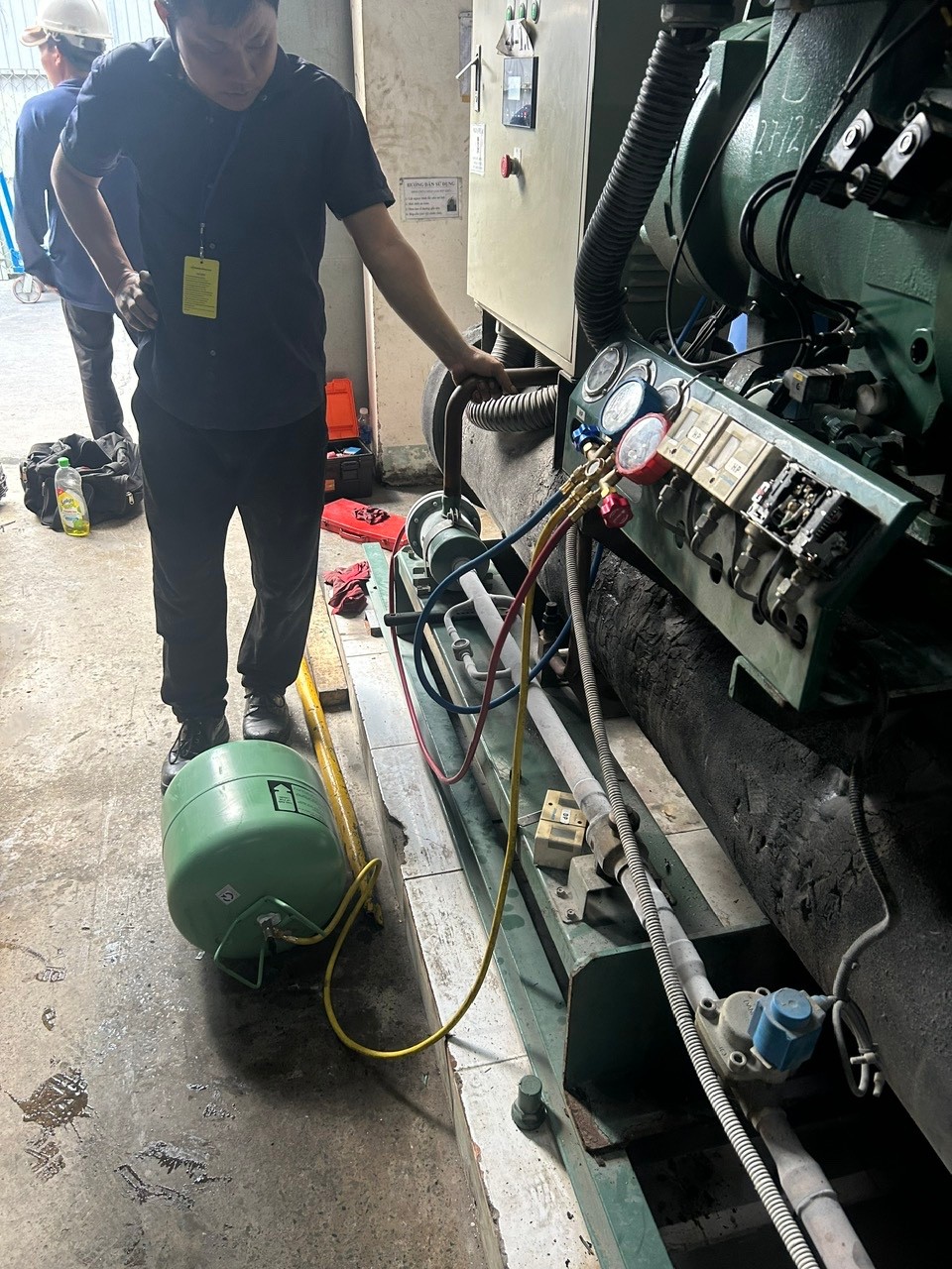 technician repairing chiller