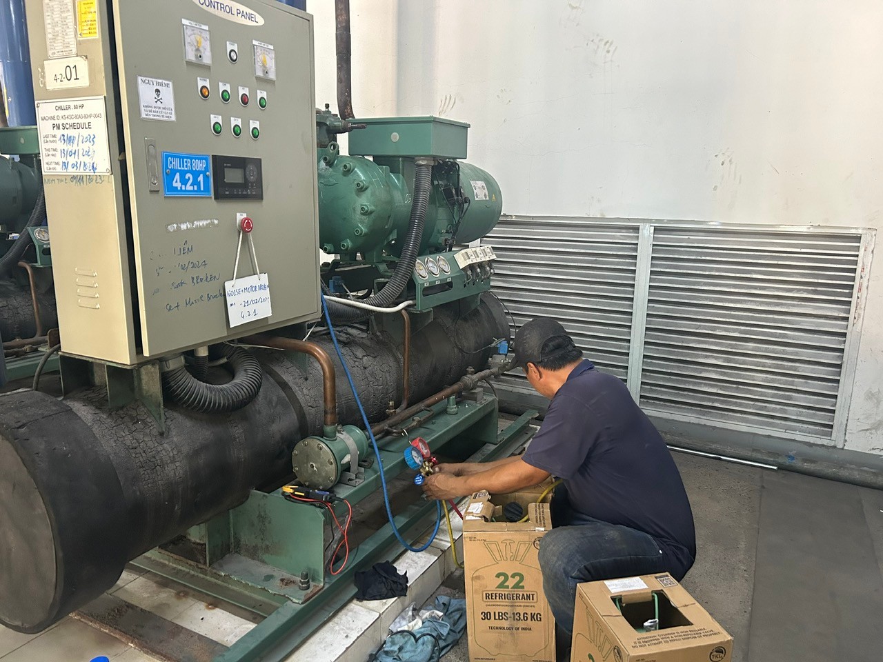 chiller repair technician in industrial setting