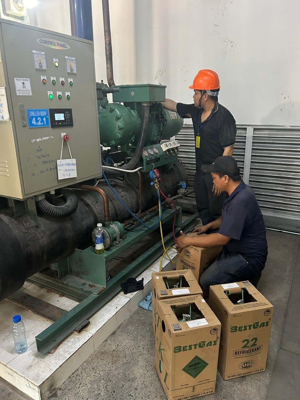 image of a technician repairing a chiller