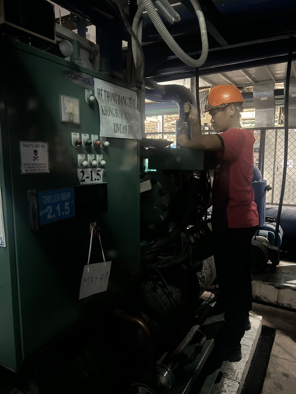 technician repairing chiller system