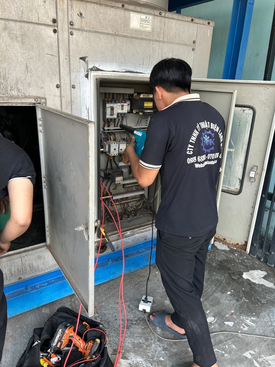 technician using diagnostic tools on chiller