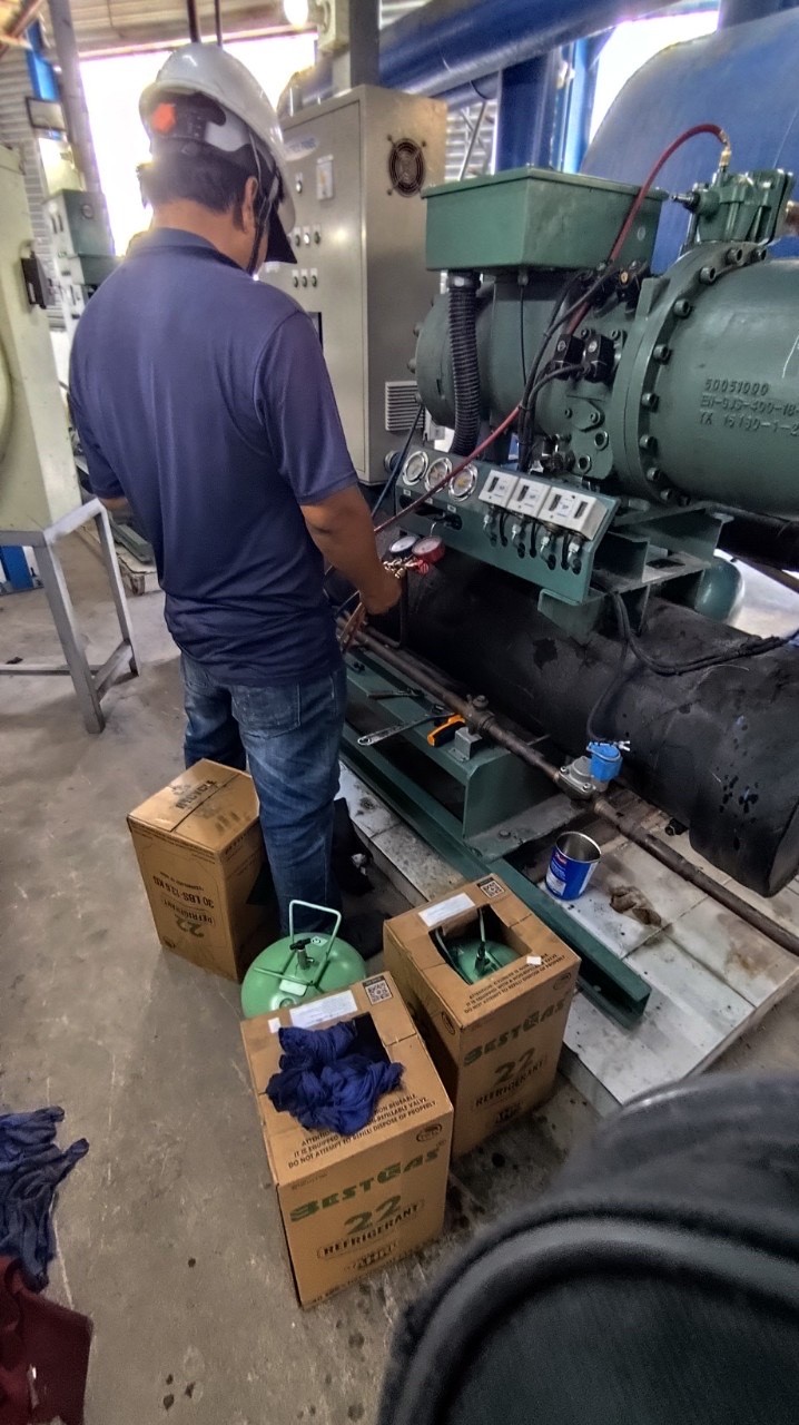 Technician repairing chiller