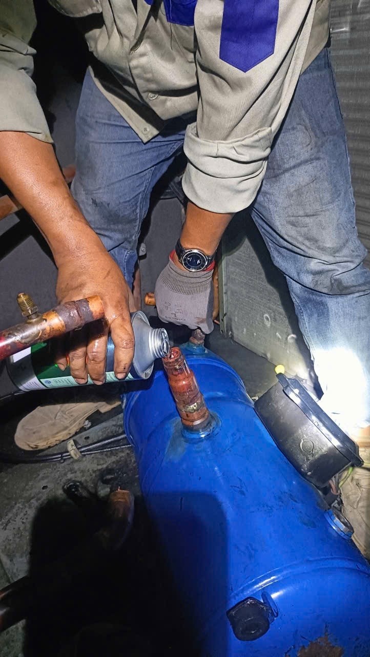 technician repairing chiller