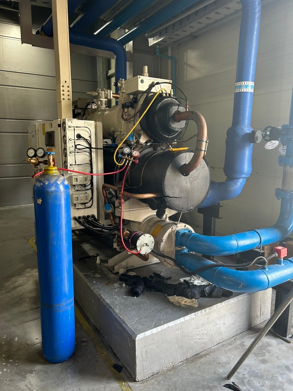 technician repairing industrial air conditioner