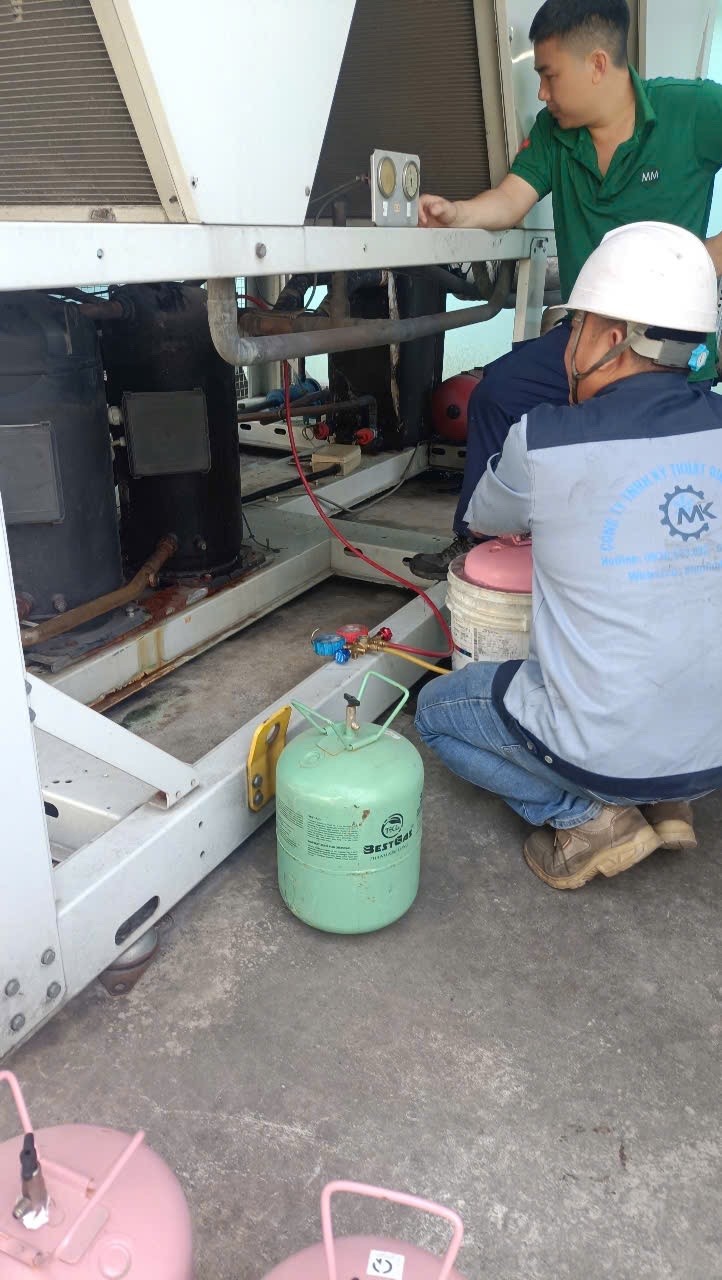 technician repairing chiller
