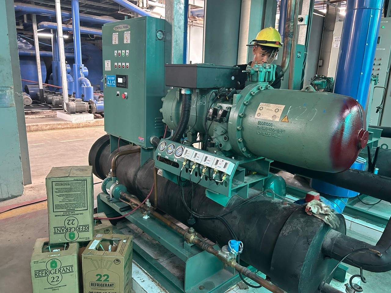 technician checking refrigerant levels