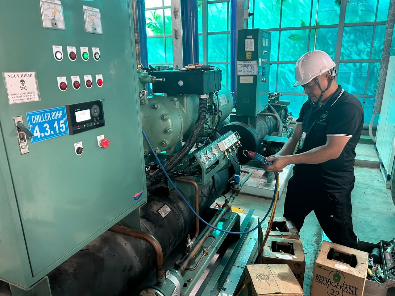 technician cleaning industrial air conditioner